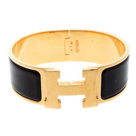 hermes bracelet black h|Hermes black and gold bracelet.